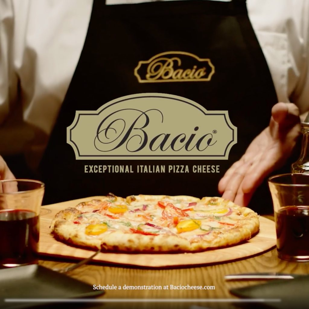 Video still demonstrating the process of making pizza with Bacio Cheese