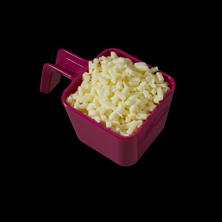 Example of a Bacio Cheese portion cup for measuring diced cheese to top a pizza